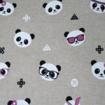 Tissu beige à motifs têtes de panda